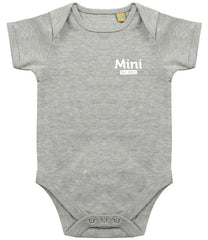 Grey baby onesie with short sleeves, featuring the text 'Mini Est. 2021' in white on the left chest area and snap closures at the bottom.