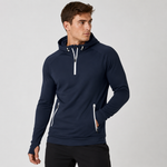 A man wearing a navy blue athletic pullover hoodie with white zipper accents and a drawstring hood, posed against a light gray studio background.