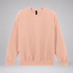 A light peach crewneck sweatshirt with long sleeves and ribbed cuffs and hem, displayed against a neutral gray background.