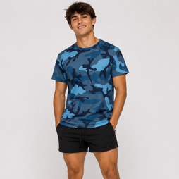 A man wearing a blue camouflage crewneck t-shirt and black shorts, standing against a light gray studio background.
