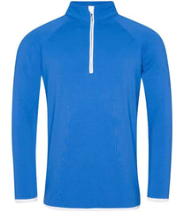 CoolFit matt finish performance fabric with superior wicking properties, UPF 40+ UV protection, slim fit, stand-up collar, raglan sleeves, zip neck with chin guard, self-fabric contrast bound zip, cuffs and hem, reflective tab on back of neck for earphones, tear-out label. In Royal Blue