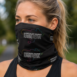 A woman wearing a black neck gaiter with a colourful map outline and the text 'Kirkcaldy Parks Running Festival' printed on it, photographed outdoors with a blurred green background.