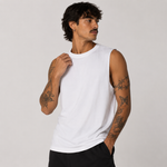 A man wearing a plain white sleeveless crew-neck t-shirt, posing against a light gray studio background.