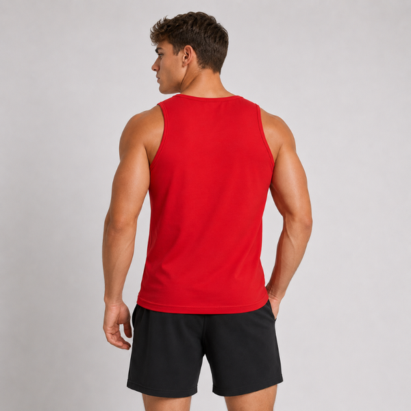 A man shown from the back wearing a bright red sleeveless tank top and black athletic shorts against a light gray studio background.