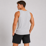 A man shown from the back wearing a light gray heather sleeveless tank top and black athletic shorts, standing against a plain light gray studio background.