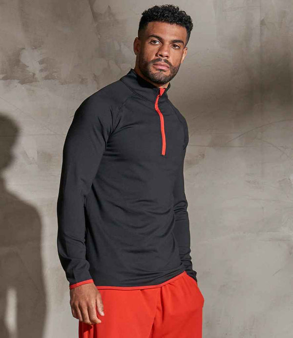 JC031 JC031 CoolFit matt finish performance fabric with superior wicking properties, UPF 40+ UV protection, slim fit, stand-up collar, raglan sleeves, zip neck with chin guard, self-fabric contrast bound zip, cuffs and hem, reflective tab on back of neck for earphones, tear-out label. In Jet Black/Fire Red Model